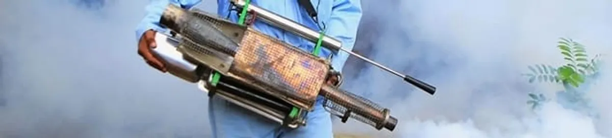 Fumigation technician using a fogger for deep pest treatment in Myrtle Beach, SC